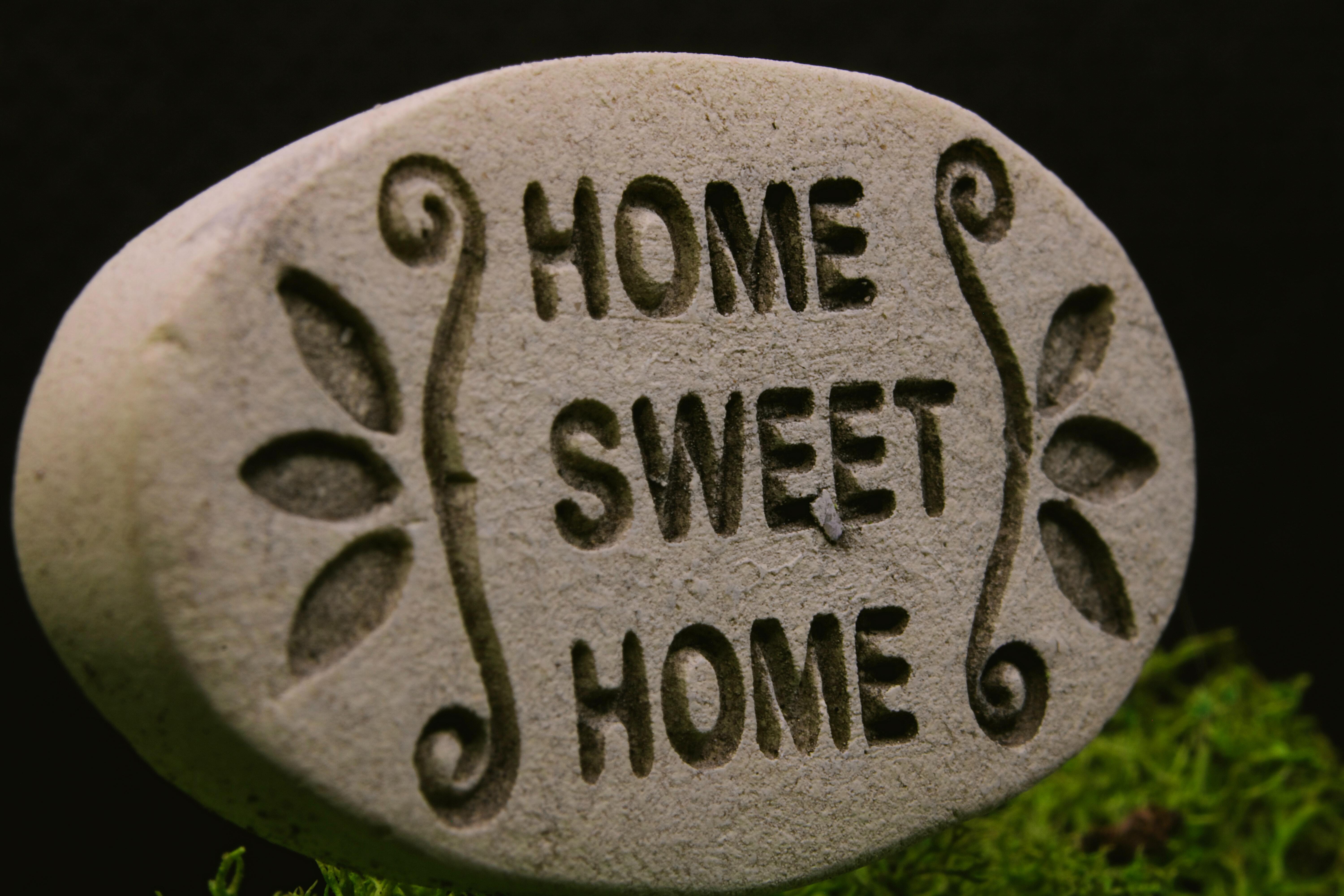 stone that reads home sweet home